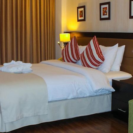 Oryx Hotel Aqaba Bagian luar foto A bedroom at the hotel